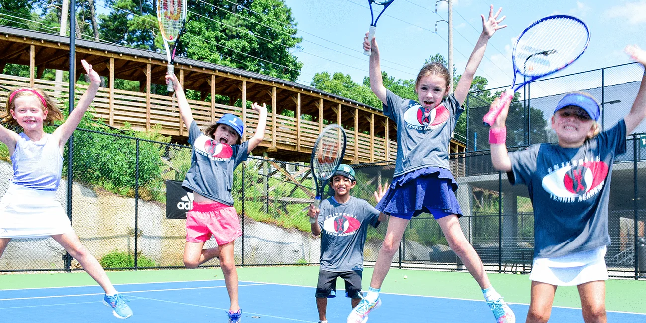 UTA (Universal Tennis Academy) Bitsy Grant Summer Camp Girls Jumping in Air