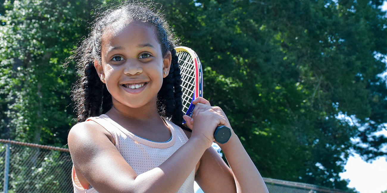 UTA (Universal Tennis Academy) McGhee Junior Program Girl W/ Racket On Shoulder