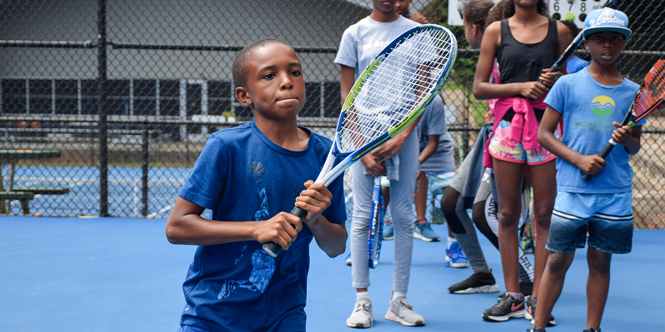 UTA (Universal Tennis Academy) Washington Junior Programs Running Boy
