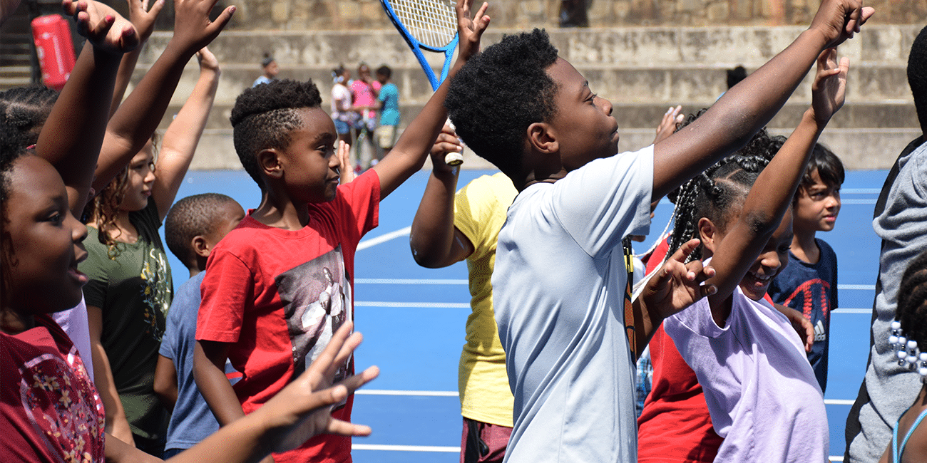 UTA (Universal Tennis Academy) Washington Summer Camp Kids Raising Hands